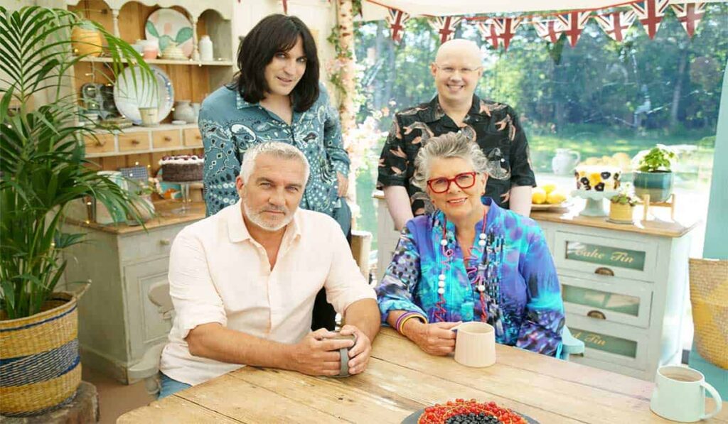 De jury van The Great British Bake Off, Noel Fielding, Paul Hollywood, Prue Leith en Matt Lucas poseren voor de camera